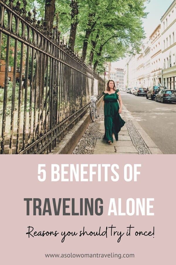 Promotional image for a blog on solo travel, featuring a woman in a green dress walking down a Berlin street with text overlay reading '5 Benefits of Traveling Alone - Reasons you should try it once!'