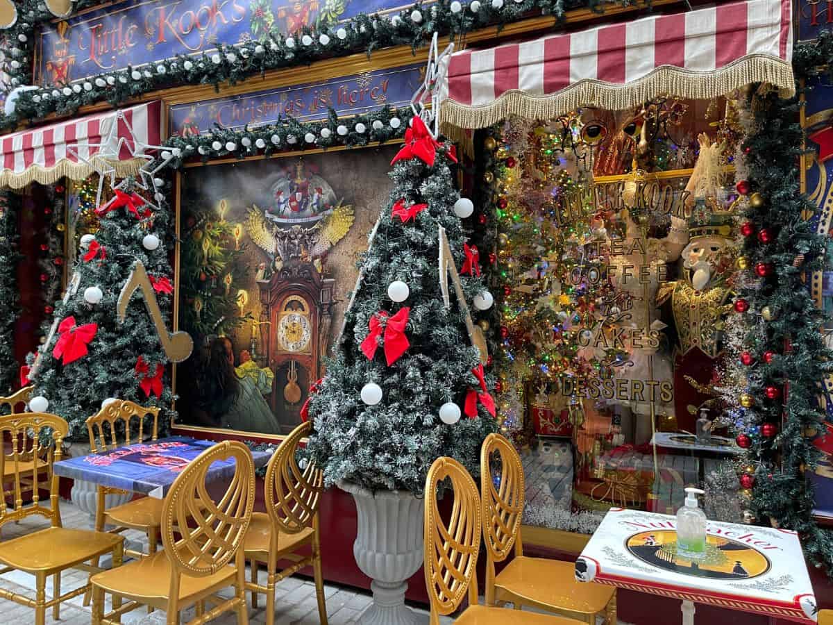 An empty restaurant with christmas trees 