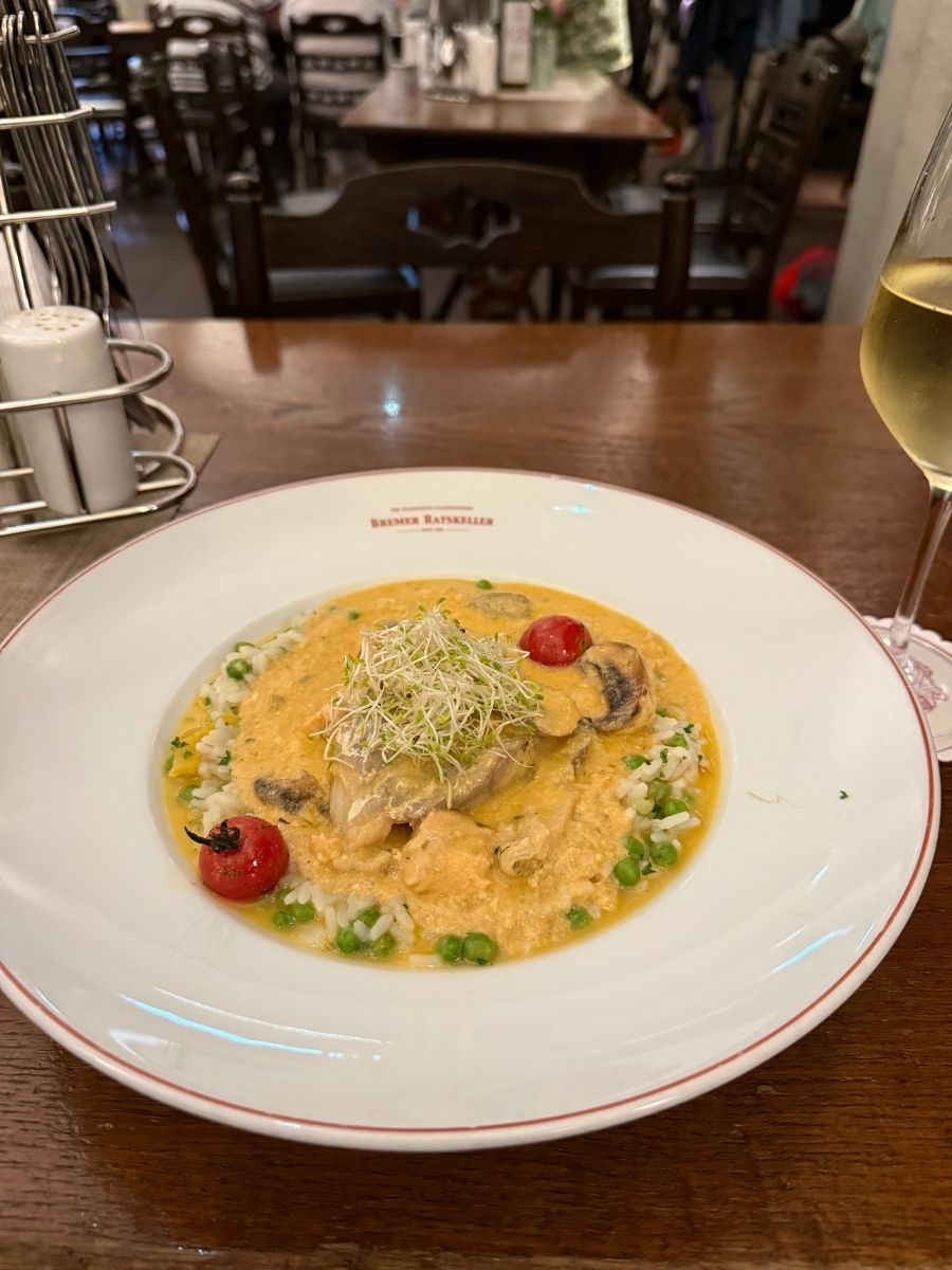 Plate of creamy chicken dish with rice at Bremen Ratskeller.