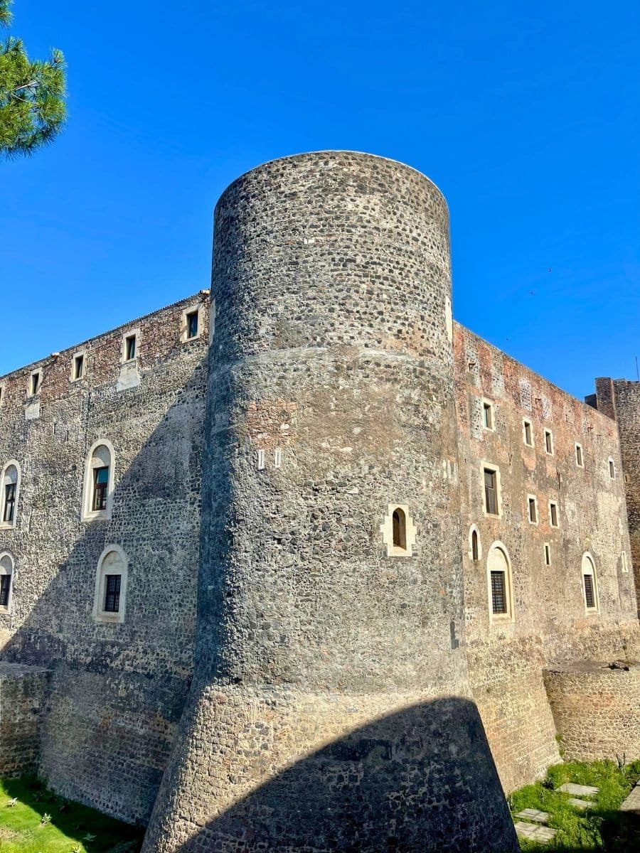Exterior view of Castello Ursino, a historic castle in Catania, Sicily, showcasing its medieval architecture and defensive walls.
