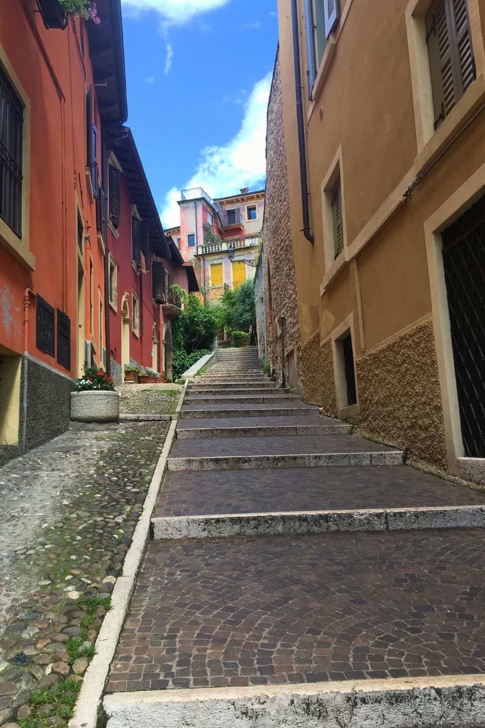A narrow pathway leading up to more steps