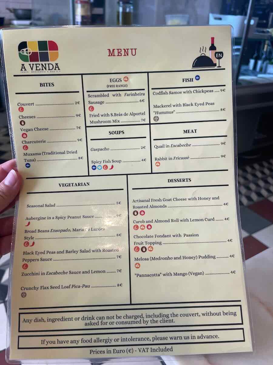 A menu from A Venda restaurant in Faro, Portugal, featuring a variety of dishes including eggs, fish, meat, vegetarian options, and desserts.