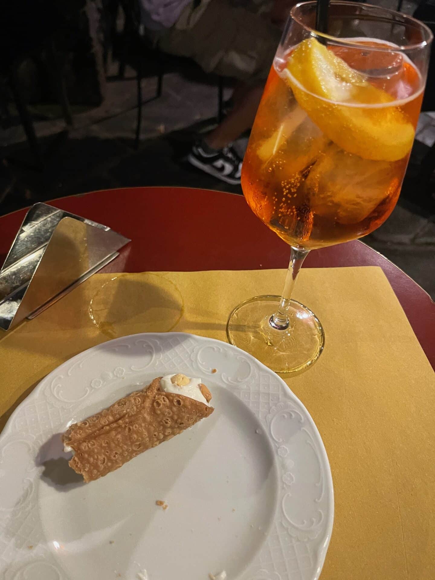 Close up of pastry and Aperol Spritz