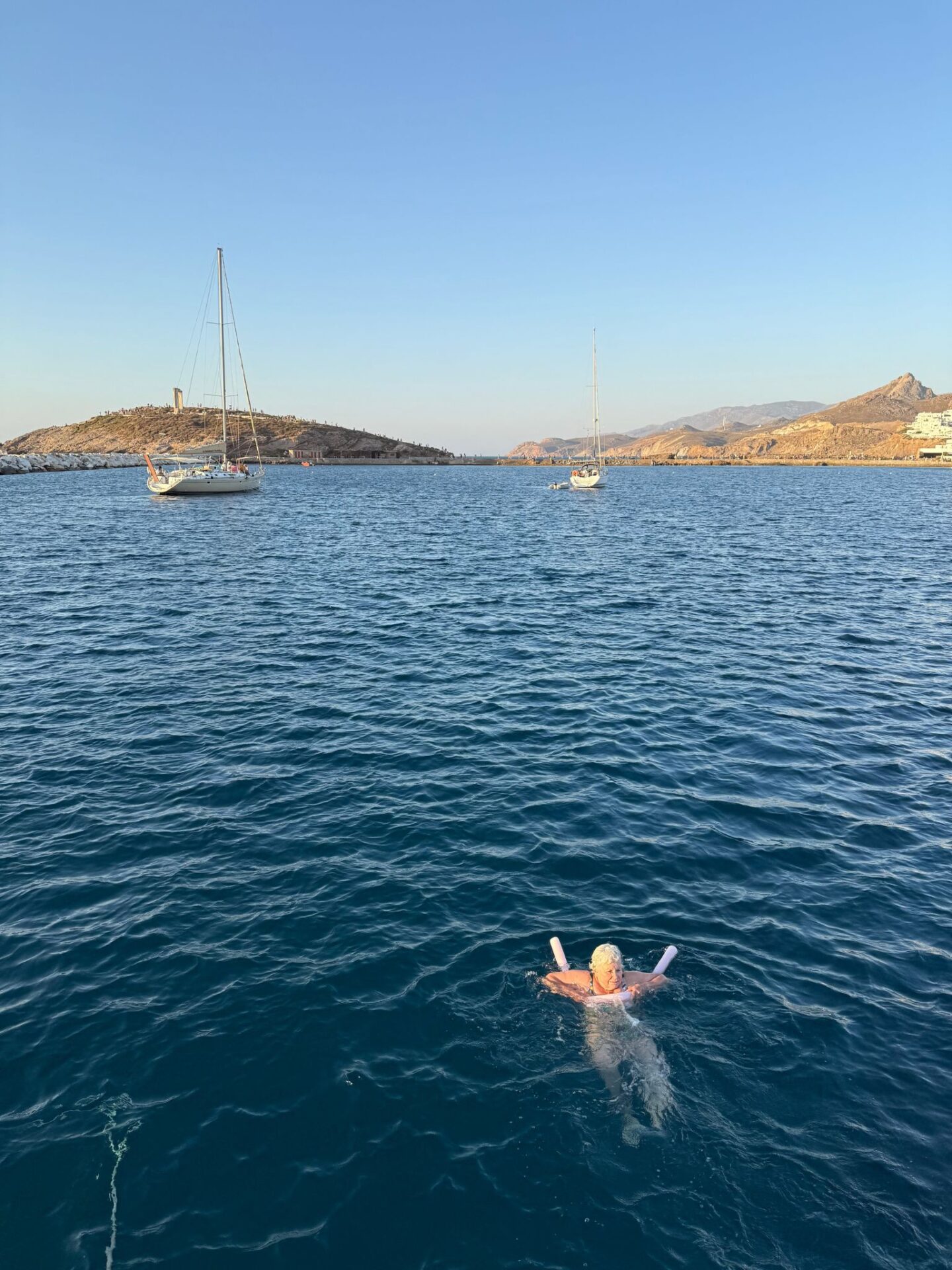 Woman alone in the water in Naxos.