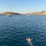 Woman alone in the water in Naxos.