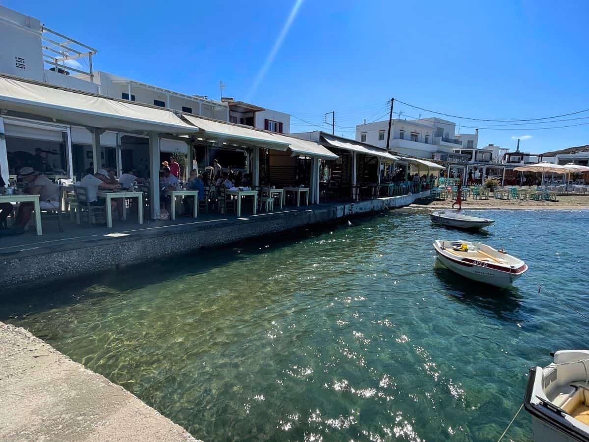 Seaside restaurant of tables and chairs in Milos