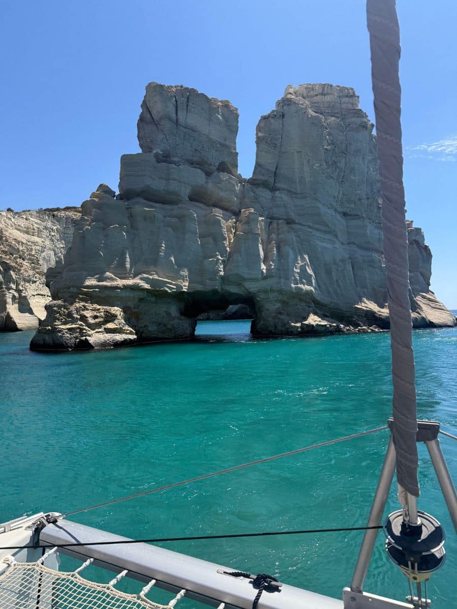 Catamaran view of Kleftiko rock formations in Milos with turquoise water on a women-only Greece tour