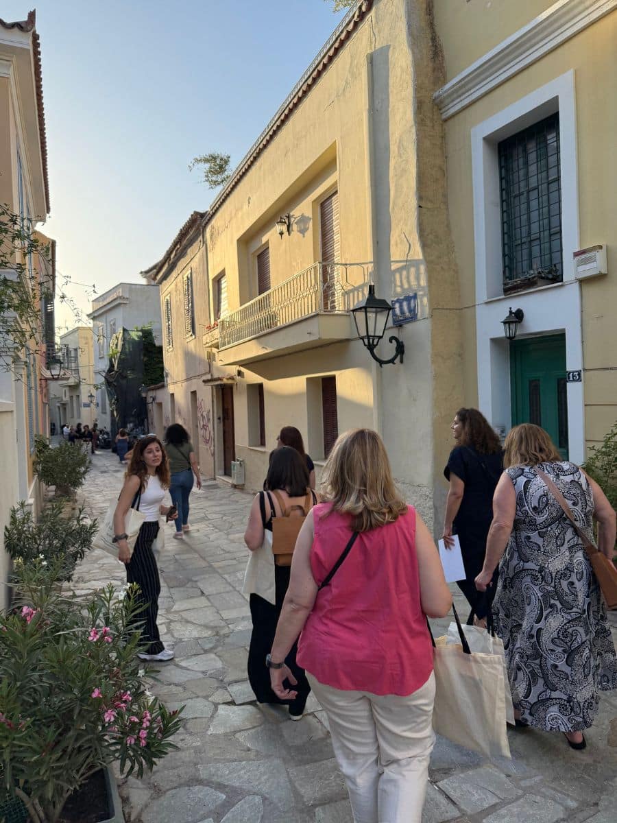 Women strolling through charming Greek island streets during a small group female-only trip