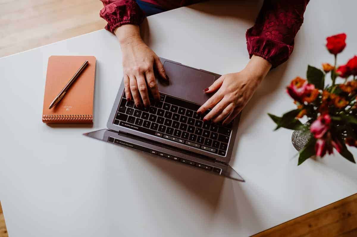 Woman hands typing on a computer
