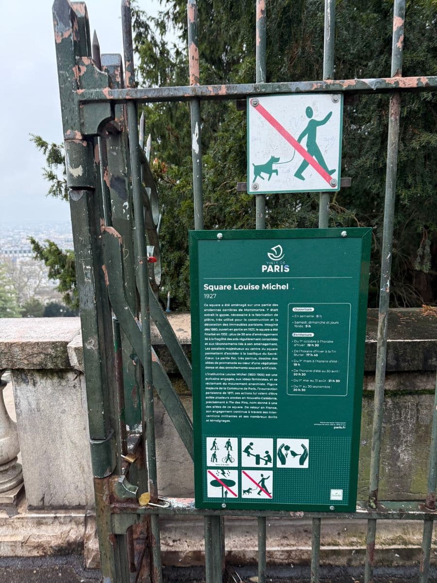 A sign at the entrance to Square Louise Michel near Sacré-Cœur displaying prohibitions, including no dogs allowed on the staircase, alongside other park rules and regulations.