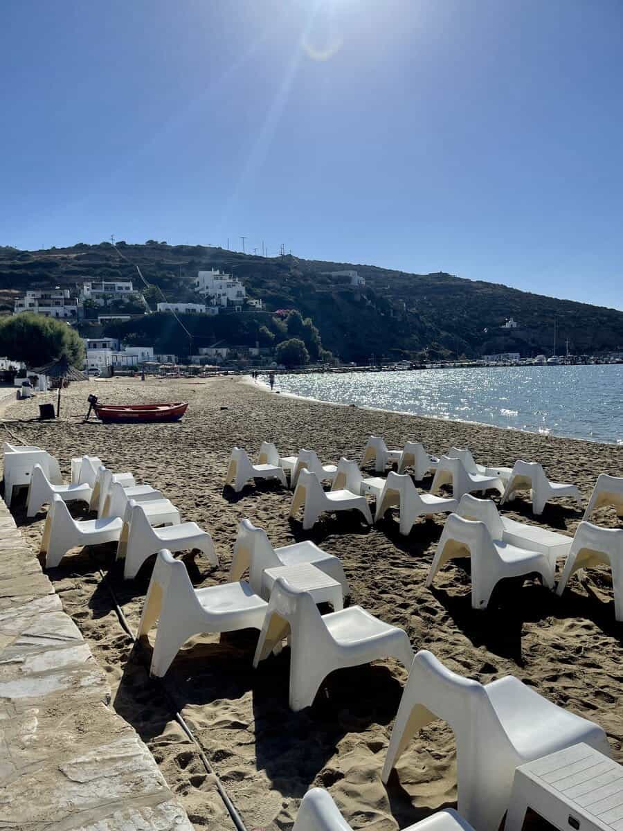 Beach in Platis Gialos with a bunch of white chairs