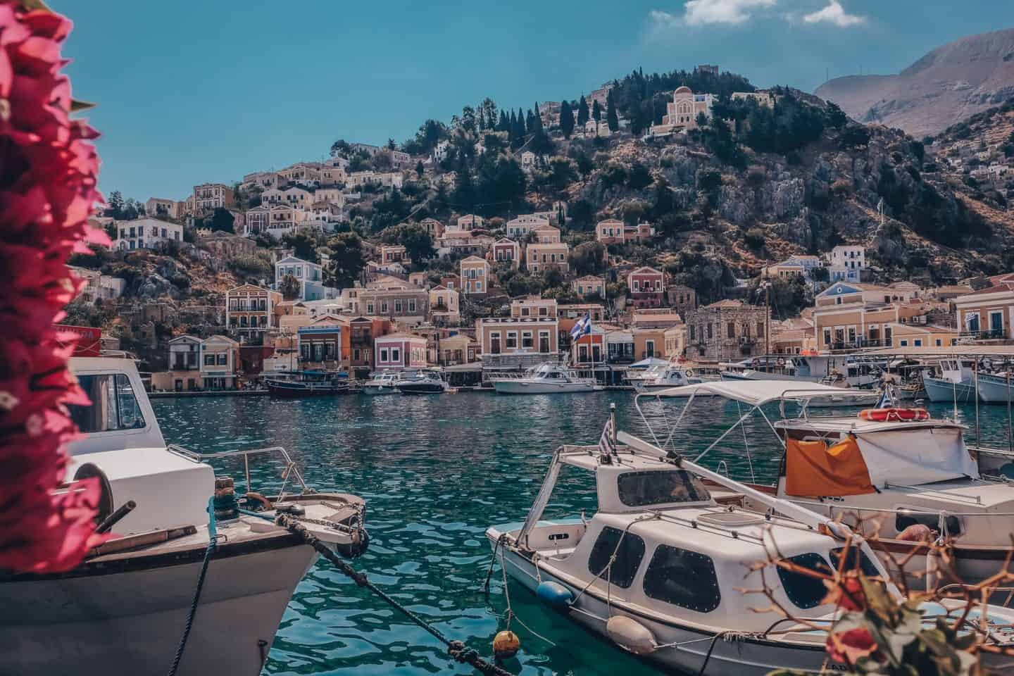 Sailboats in the harbor in Symi, Greece, one of the stops on my Rhodes itinerary for solo females.