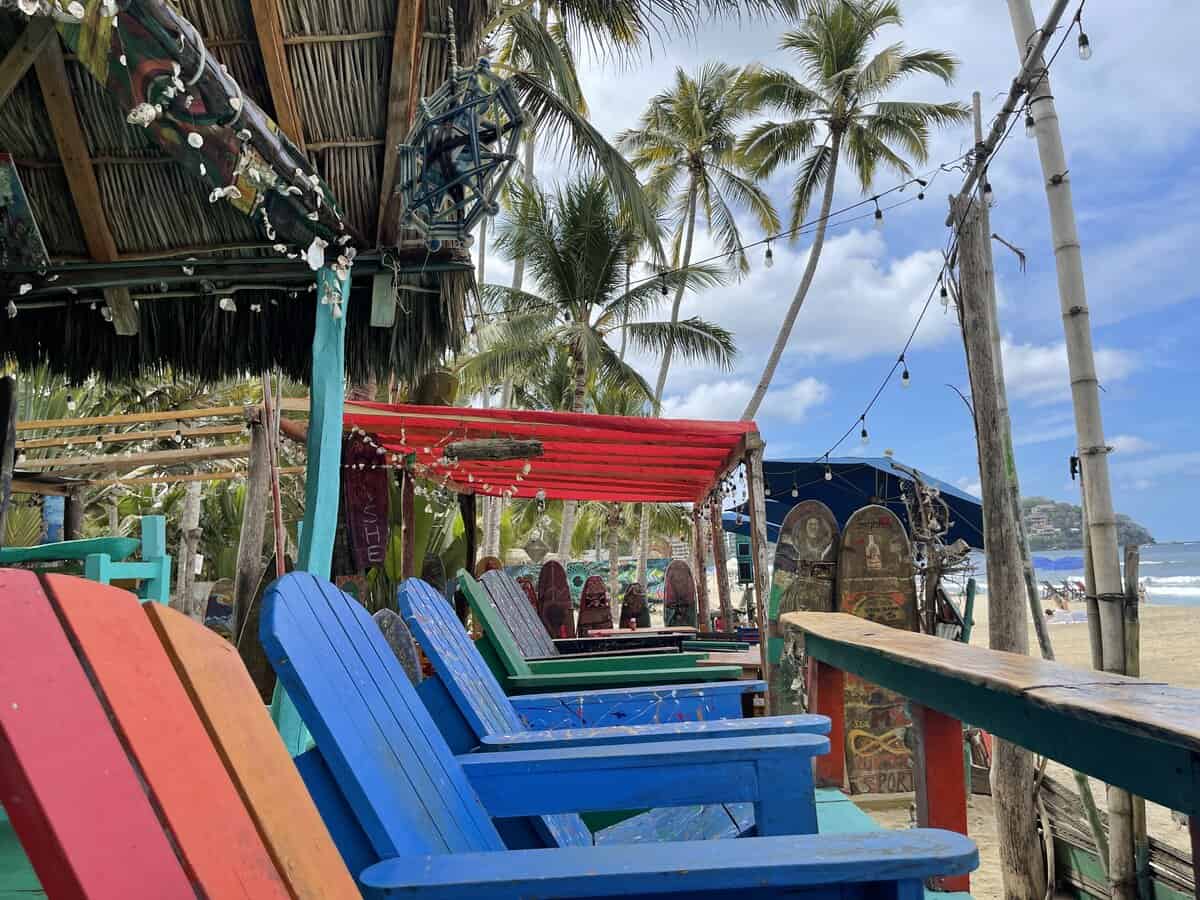 Colorful beach chairs in Sayulita looking out at the ocean
