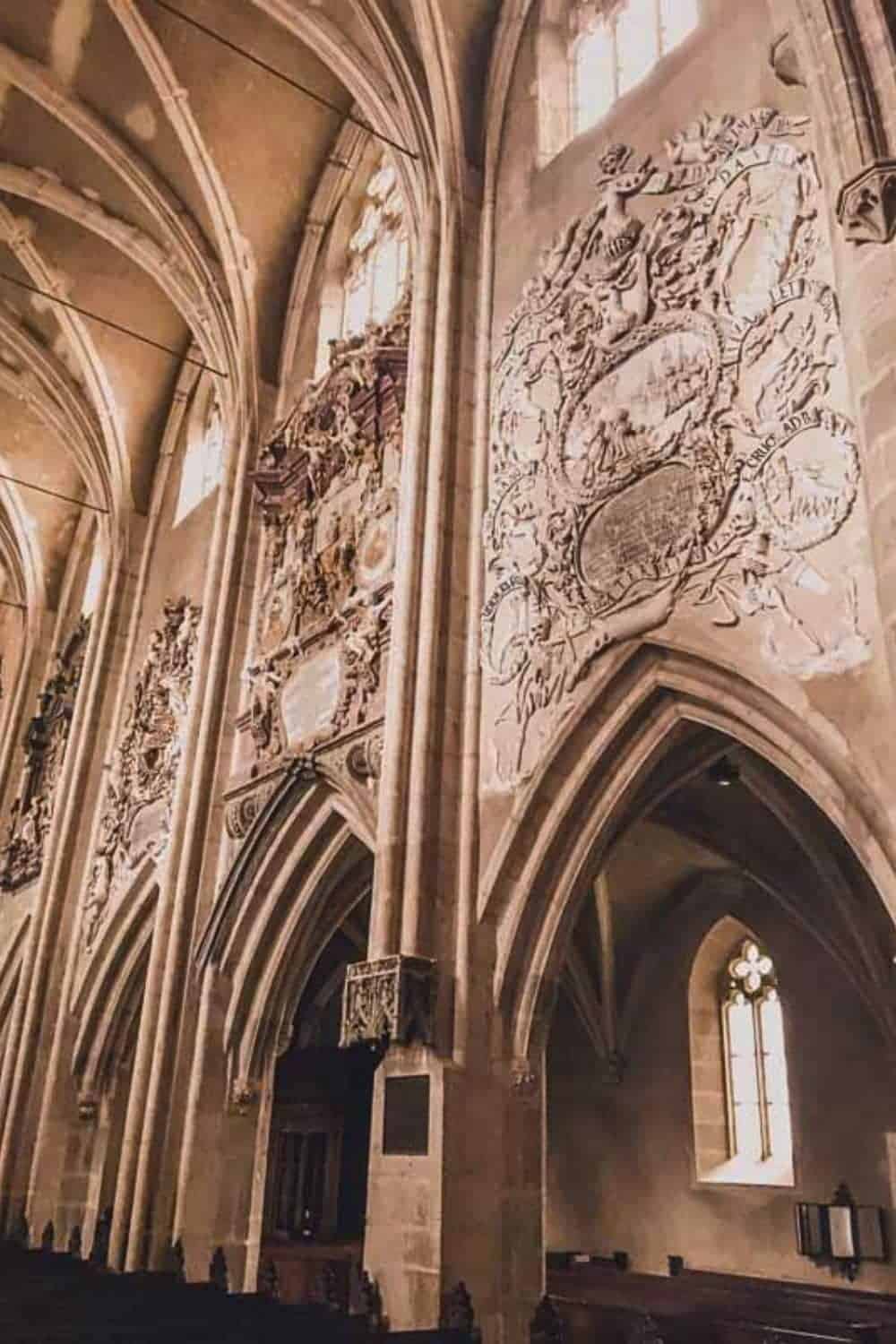 Detailed stonework on the walls of Sibiu's Lutheran Cathedral, reflecting the historical and artistic significance that makes Sibiu a worthwhile visit.