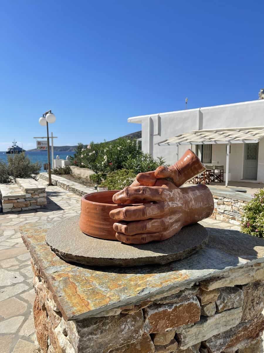 Clay hands on a stone wall in Sifnos Greece