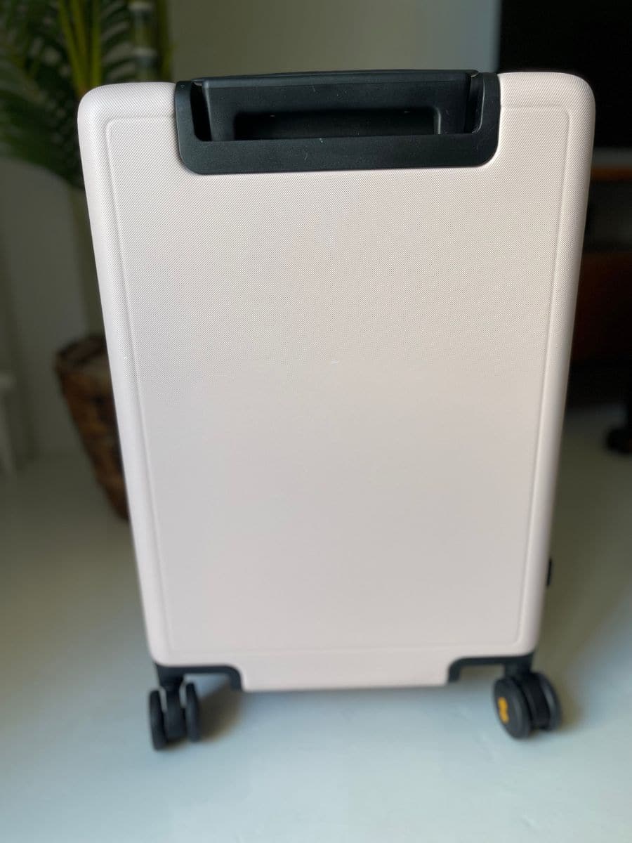 the back of a Pink suitcase 