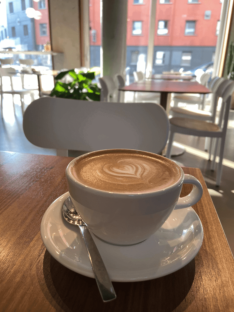 A latte on a table in Black Apron, one of the best cafes to work in Berlin.