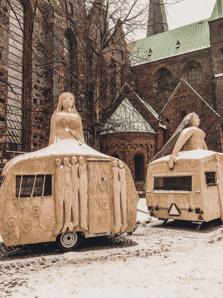 Perfect Copenhagen to Aarhus Itinerary, travel trailers decorated with statues of women.