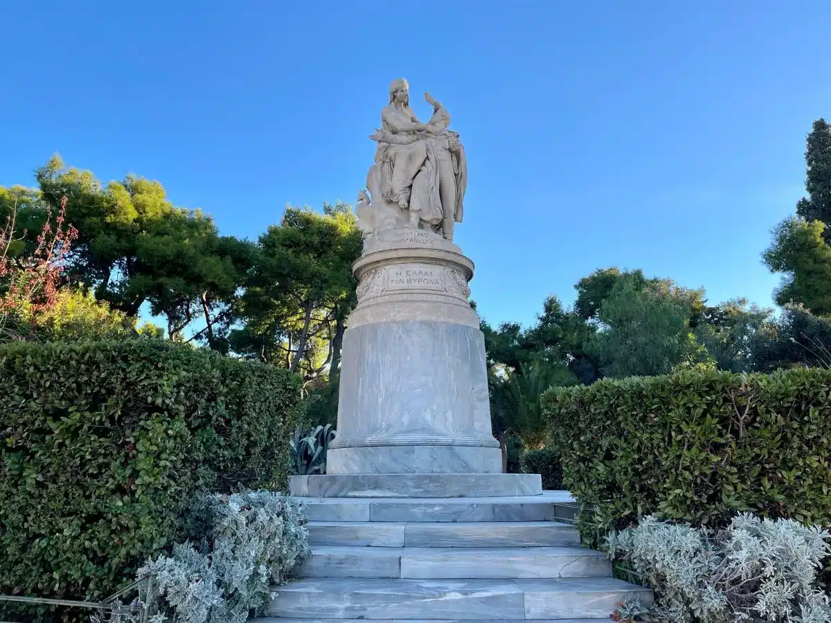 a park in Athens and large statue of a woman waiving